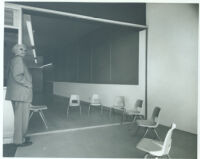 Le Moore School, Richard J. Neutra in doorway of classroom