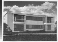 Avion Village, two-story building with painted landscape