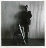 Dion Neutra, portrait, standing against wall, 1969