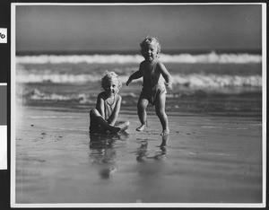Children playing the surf at a Los Angeles area beach, ca.1930