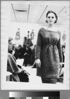 Oversized reprints of models wearing Cashin's fashion designs