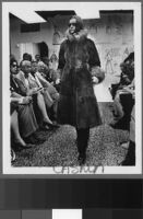 Black and white photographs of Cashin's fur coat designs for H.B.A. Fur Corp