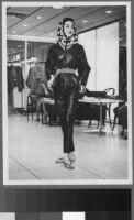 Black and white photographs of Cashin's ready-to-wear designs for Sills and Co., modeled in Sills' showroom