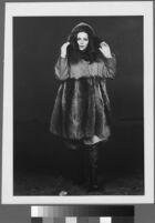 Oversized reprints of models wearing Cashin's fashion designs