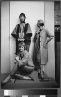 Oversized reprints of models wearing Cashin's fashion designs