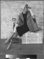 Oversized reprints of models wearing Cashin's fashion designs