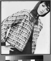 Oversized reprints of models wearing Cashin's fashion designs