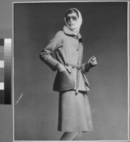 Oversized reprints of models wearing Cashin's fashion designs