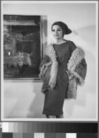 Black and white photographs of Cashin's ready-to-wear designs for Sills and Co., modeled in residential interiors including Cashin's New York apartment