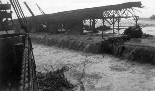 Tsunami wave washing over Pier 1 in Hilo on the Big Island of Hawaii