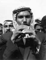 Close-up of a man playing the zumara with several