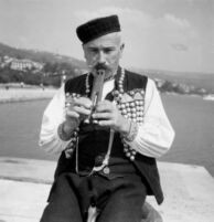 Close-up of a man playing sargija or saz