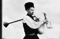 Close-up of a man playing gajde (bagpipe) in Kasil