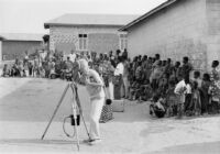 Mantle Hood in Ghana, filming "Atumpan: the Talking Drums of Ghana."