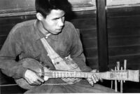 Blind man playing a plucked lute