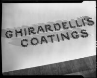 Advertisement photograph with "Ghirardelli's Coatings" spelled with chocolate bon-bons