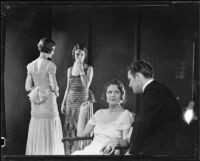 Three women and one man at a photograph session for an advertisement, 1935