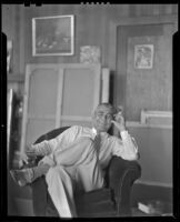 Stanley Reckless seated in the studio of his Silver Lake home, Los Angeles, 1930-1939