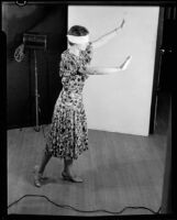 Blindfolded woman reaching out, image taken for an Adohr Farms advertisement