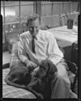Paul Sample in his studio with his dog, Pasadena, circa 1935