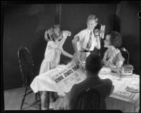 Girl drinking milk at the breakfast table with her family on the first day of school for an Adohr advertisement