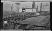 Oil field with gas regulator equipment, probably by the Wilgus Manufacturing Company, California, circa 1931