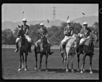 Dave Whyte, Darryl Zanuck, Lucian Hubbard and Raymond Griffith posing on their polo horses, Los Angeles, 1931