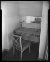 View of a recess with an art deco wood veneered table in "Irene LTD," a dress shop of designer Irene Lentz Gibbons, Los Angeles, (circa 1930?)