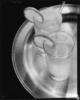 Glasses of a beverage with lemon slice ornaments for a Sunkist advertisement