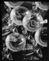 Photomontage composition with repeated images of a man playing a tuba, 1925-1939