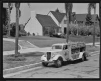 Arrowhead-Puritas spring water delivery truck in a residential neighborhood, Los Angeles County, between 1929-1939