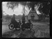 Will Connell (possibly) and another man next to parked motorcycles in front of a rural church, circa 1920