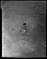 William J. Conselman in a swimming pool at the William Conselman Residence, Eagle Rock, 1930-1939