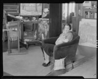 Woman with cat, probably the wife of artist Stanley Reckless, in the studio of their Silver Lake home, Los Angeles, 1930-1939