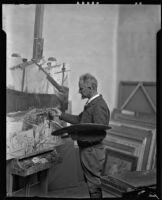 Carlos Vierra working on a painting in his studio, Santa Fe, 1932