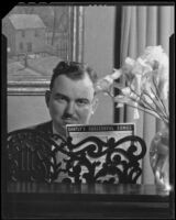 George Sprague seated at a piano, circa 1930-1939