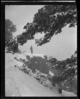 Man in snow-covered landscape, circa 1920