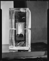 Icebox reflected in two large blocks of ice, 1930-1937