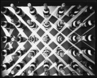 Mission Dry Sparkling carbonated fruit beverage bottles arranged in a grid formation, Los Angeles, circa 1930