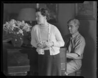 Stanley Reckless, seated at a piano, with his wife (?) in his Silver Lake home, Los Angeles, 1930-1939