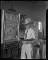 Sheldon Parsons working on a painting in his studio home, Santa Fe, 1932