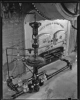 Gas regulator equipment created by the Wilgus Manufacturing Company connected to a Pioneer boiler, Los Angeles, circa 1931