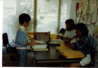 Connexxus office: Three women preparing Connexxus mailings