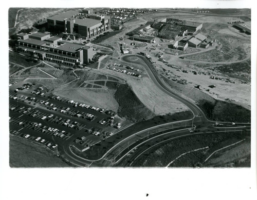 Aerial view of parking lot, Library, and Fine Arts construction