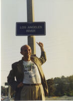 Lewis MacAdams with the Los Angeles River sign