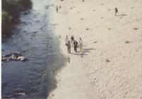 People walking alongside the Los Angeles River