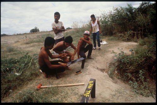 Border Sutures: Young men with metal sutures