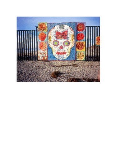 Cross Project installation: Y mas de 1,000 migrantes no identificados, with skull and flower imagery