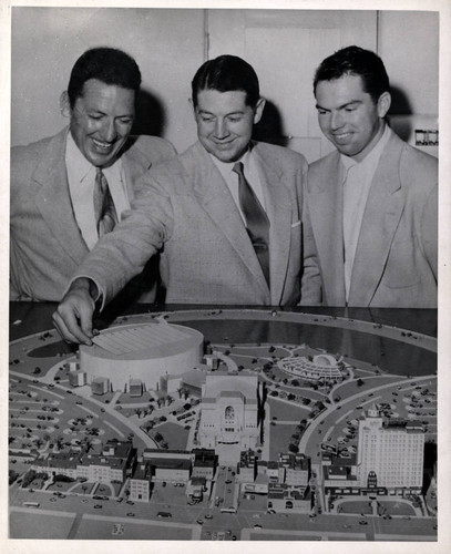 Men Study Scale Model of Long Beach Arena