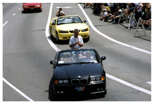 Alan Lowenthal rides in parade